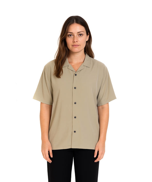 Woman wearing strada bowling club sage green short-sleeve shirt on a white background